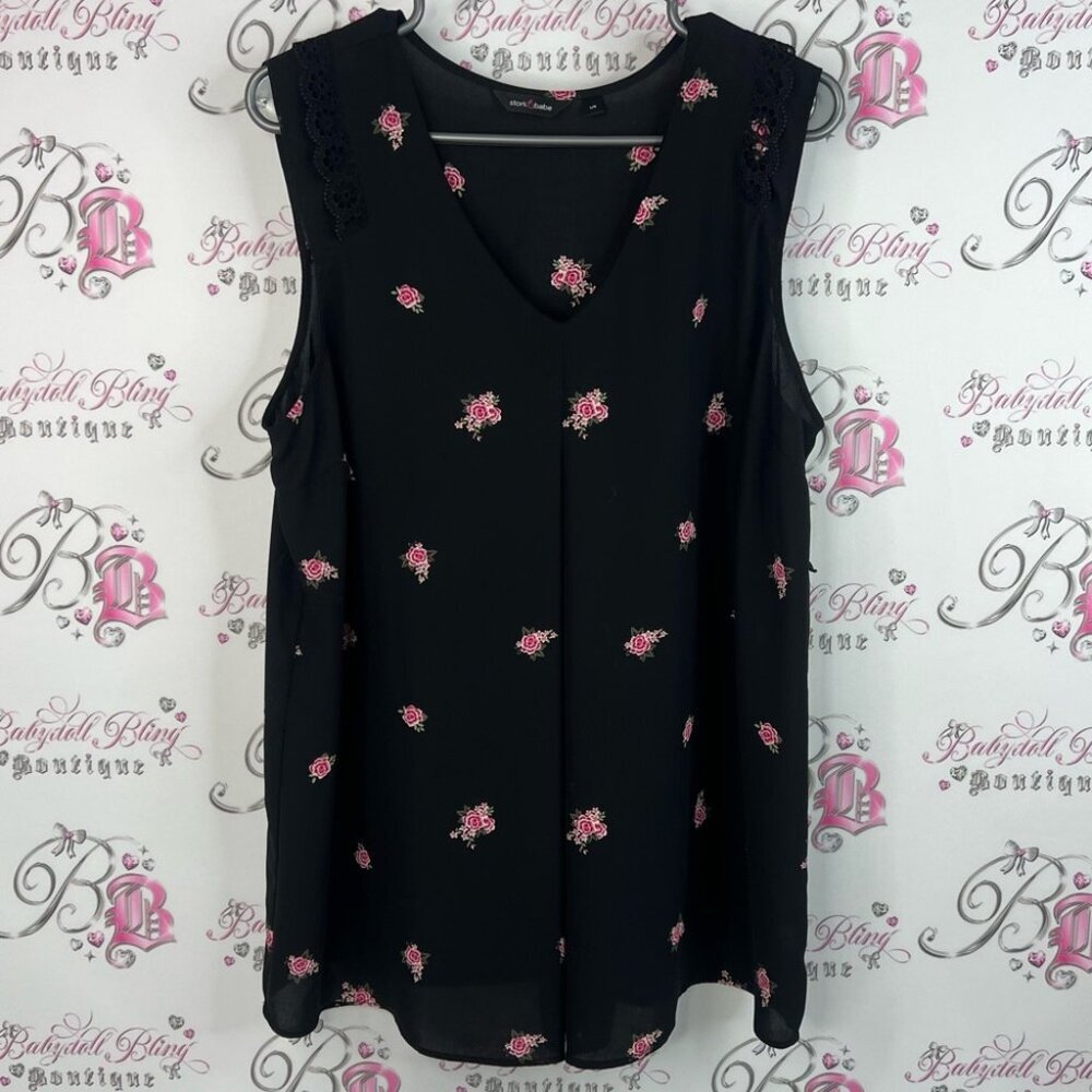 Stork and babe tank top Chic Black Sleeveless Blouse with Pink Floral Design